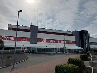 Cardiff Airport - a white building with a red banner across the centre.