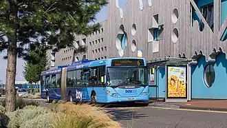 A blue Baycar-branded bendybus in Cardiff