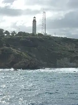 East Point Lighthouse on Ragged Point from the northern end of Cobblers Reef.