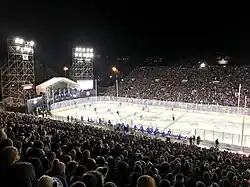 A football stadium with a hockey rink in the center
