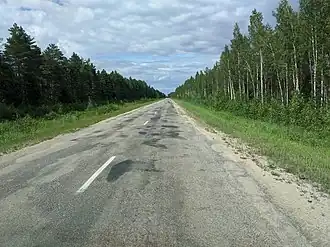 Latvian regional road P86 in 2020, uneven and over-patched