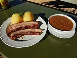 Smoked meat with beans and potato dumplings