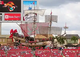 A large pirate ship behind the seats in the stadium