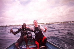 Roger C. and pirogue owner "Tiny" after diving on Cobblers Reef.