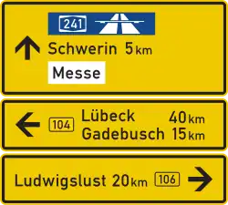 Schwerin, Lübeck, Gadebusch, Ludwigslust are shown on the sign. It is yellow. It has three directions. Schwerin is the closest place.